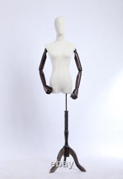 Dress form, fabric-covered torso, wood arms and fingers adjustable, wooden stand